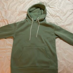 Green hoodie with text on the back, never worn